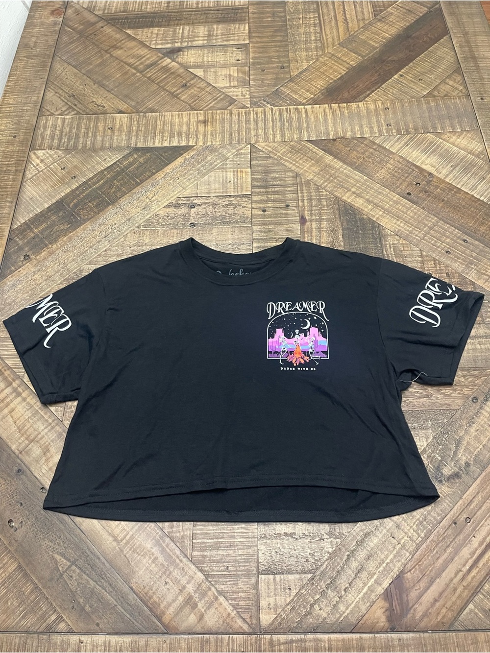 Weekend Warrior "Dreamer" cropped t-shirt featuring a skeleton graphic